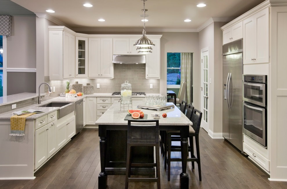 Kitchen renovation - recessed lights, pendant lights, and outlets installation by First Aid Electric.