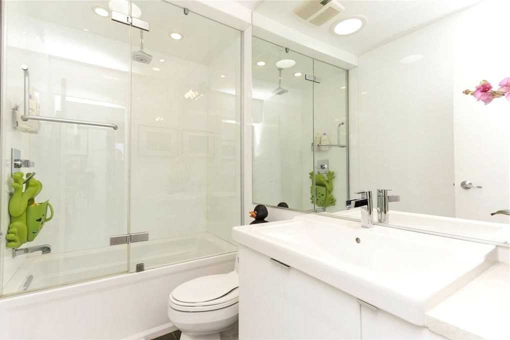 Calgary bathroom shower recessed lights, exhaust fan, GFCI outlet installation by First Aid Electric Calgary.