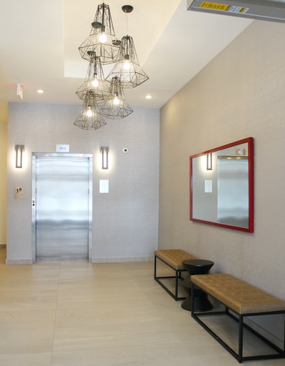 Condominium foyer lighting, emergency lighting, receptacles, elevator by First Aid Electric.