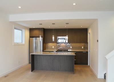 New home duplex recessed lights, under cabinet lights, pendant lights, smoke detectors, GFCI receptacles, outlets, switches, dimmers, electrical panel installation by First Aid Electric Calgary.