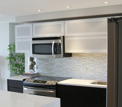 Condominium kitchen recessed and under cabinet lighting installation by First Aid Electric.