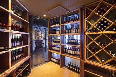 Commercial restaurant wine room lighting and thermostat by First Aid Electric Calgary electricians.