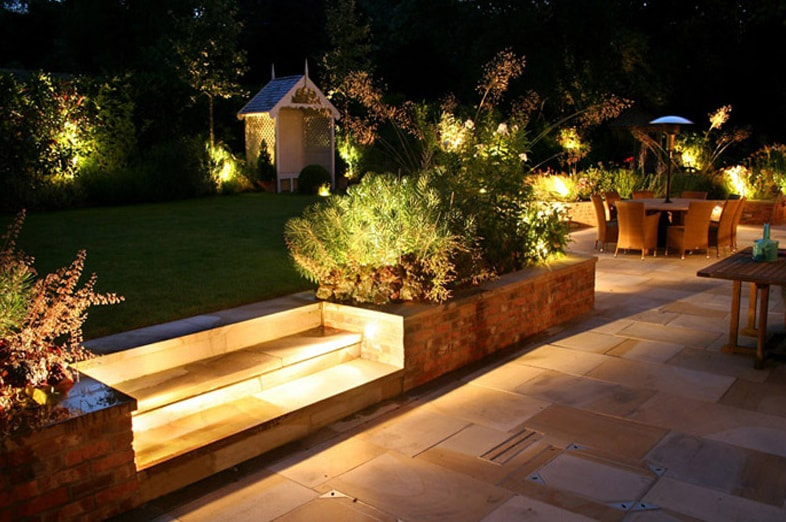 Calgary outdoor backyard landscaping lights by First Aid Electric.