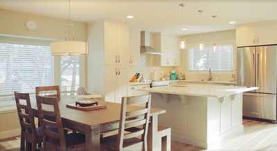Kitchen recessed lights, pendant lights, dining light installation by First Aid Electric Calgary electricians.